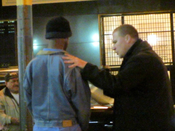 KRIS PRAYS WITH MAN AT 16TH & MISSION